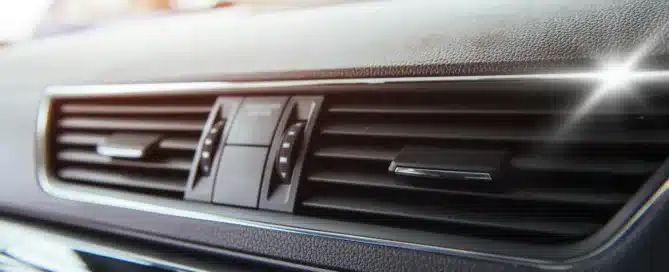 Mechanic performing car AC repair at Carage Auto, a top-rated full-service auto repair shop near you.