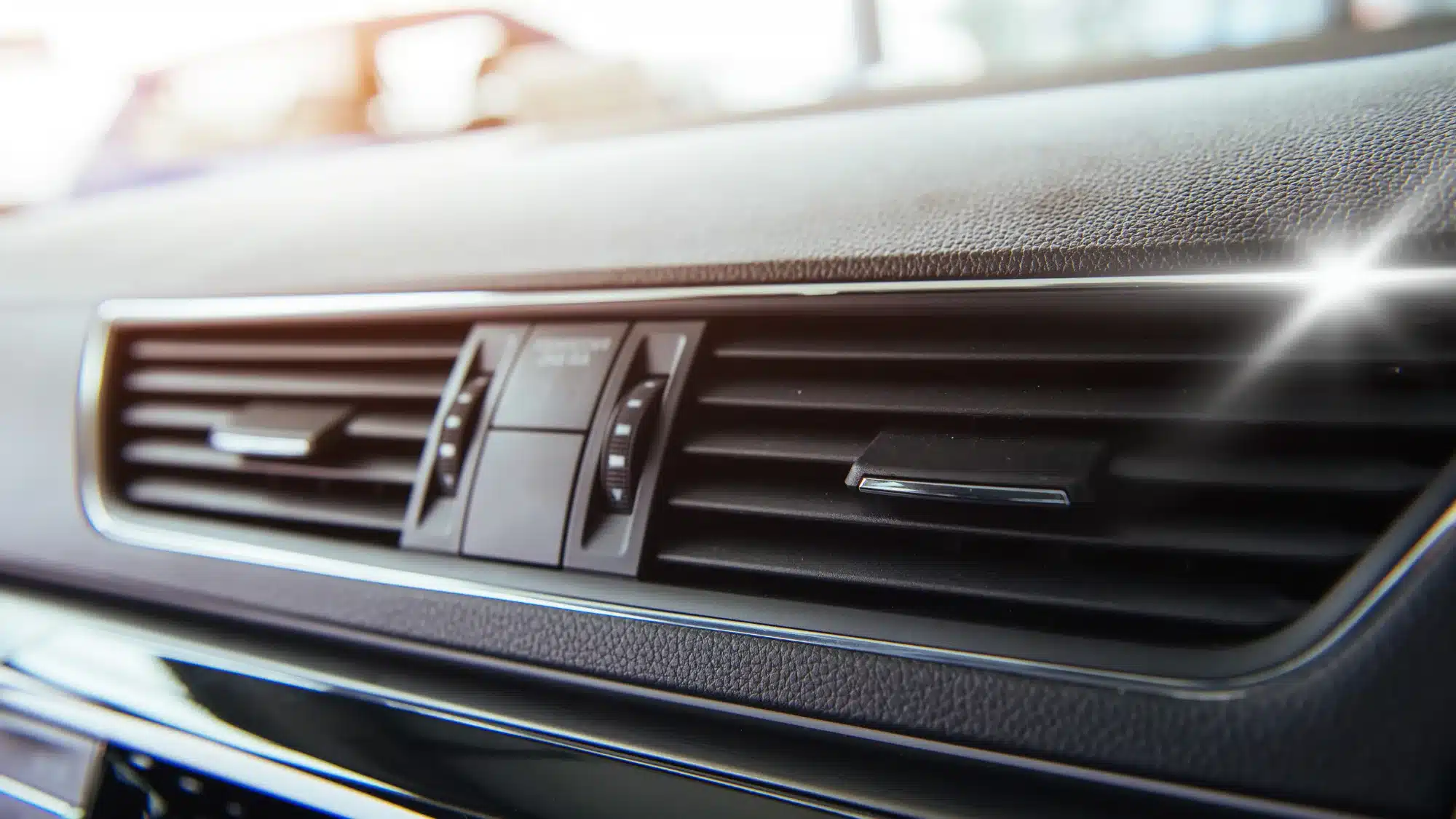 Mechanic performing car AC repair at Carage Auto, a top-rated full-service auto repair shop near you.