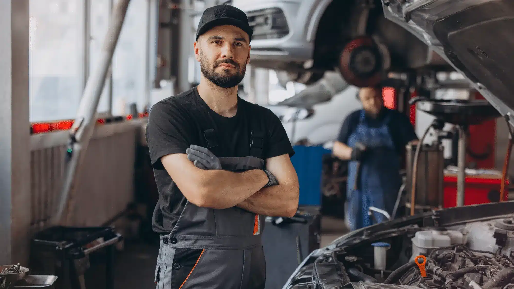 A certified Ford technician repairing a car at a Ford auto shop near me