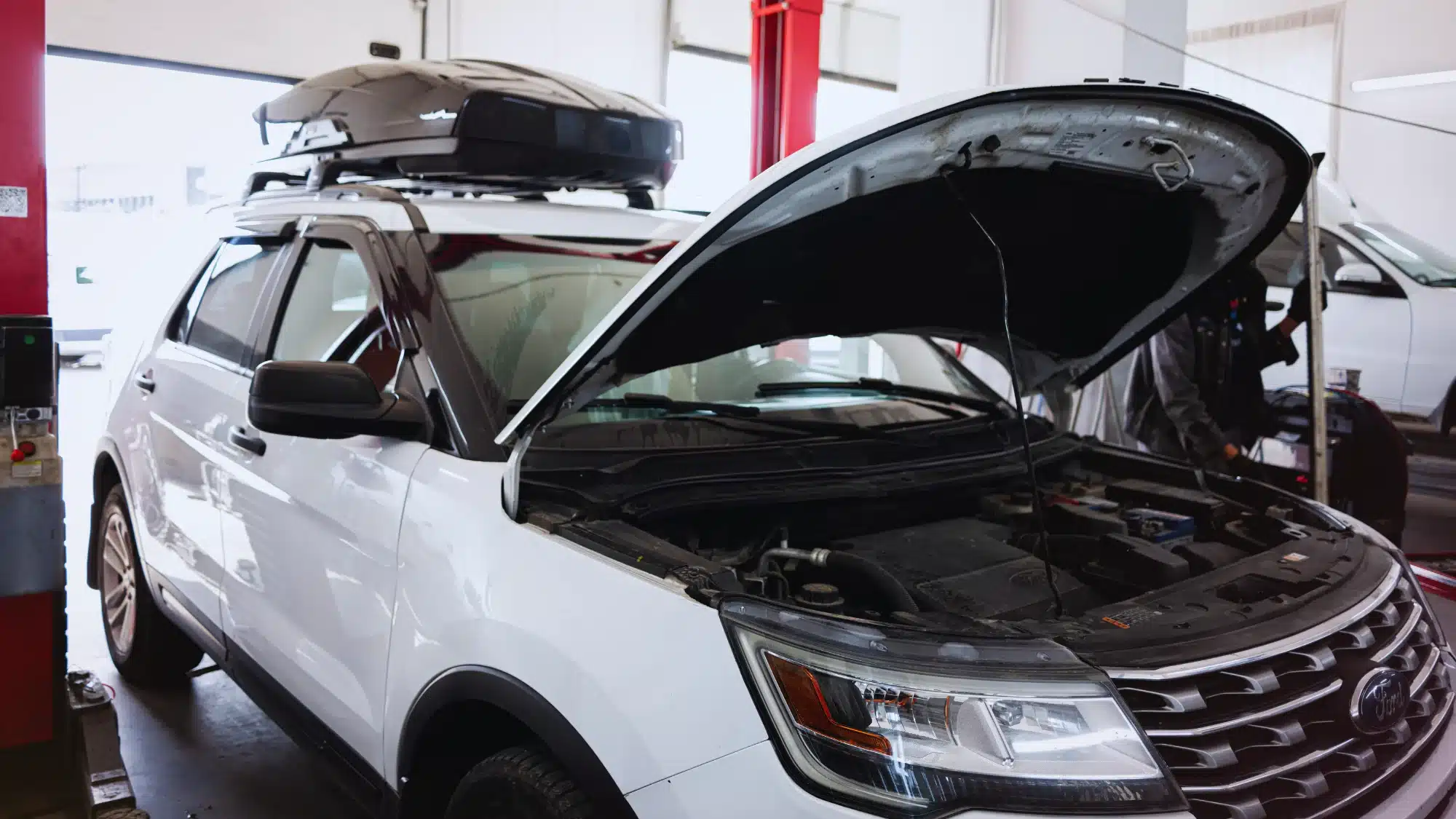 Professional Ford Auto Repair Service Technician Inspecting And Maintaining A Ford Vehicle To Support Reliable Performance And Long-Term Dependability.