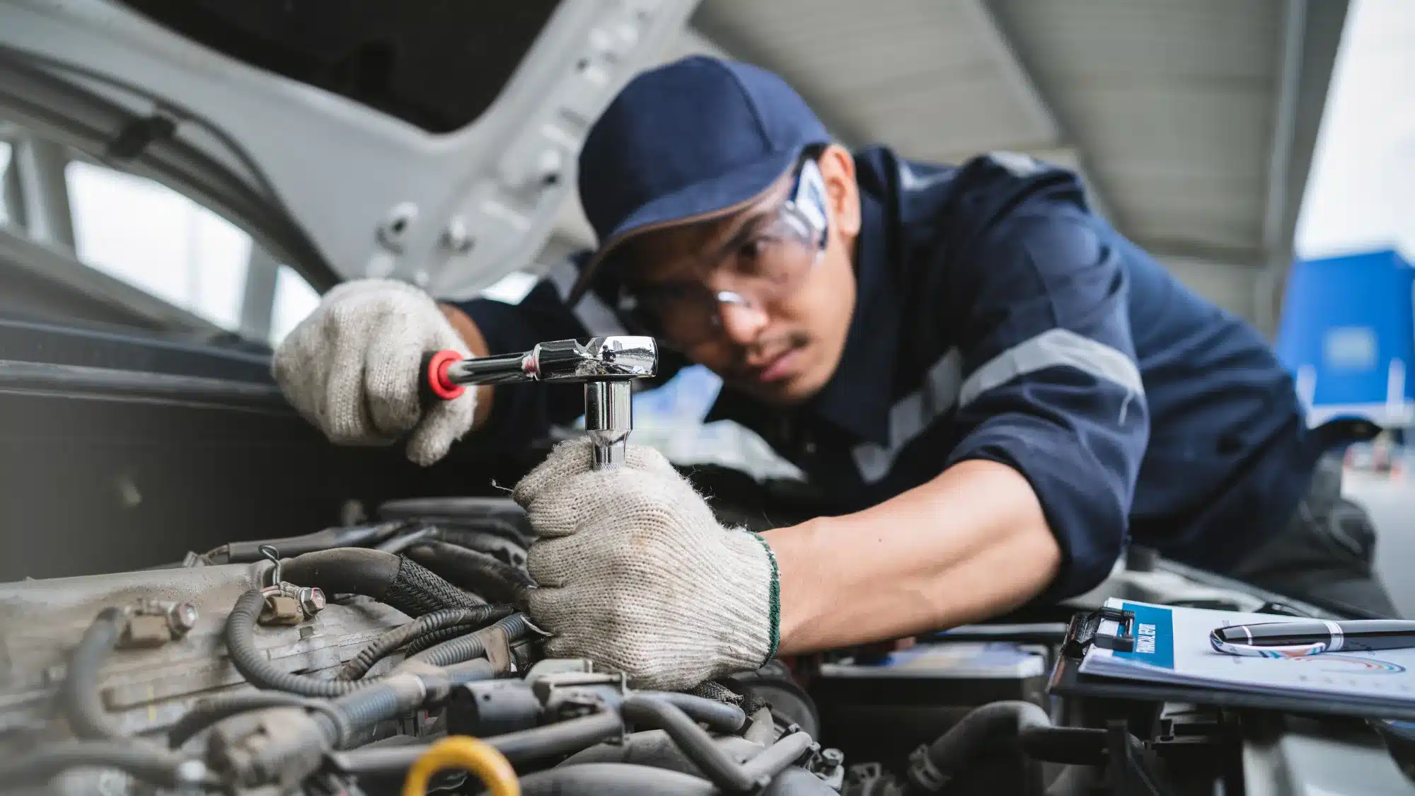 Close-up of an independent Hyundai auto mechanic near me servicing a vehicle.